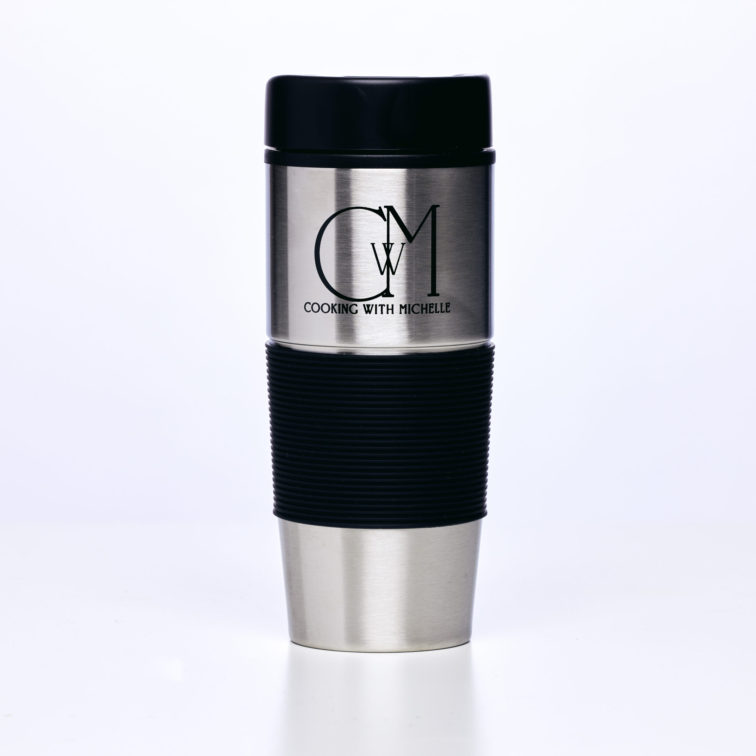stainless steel tumbler with black top on white background